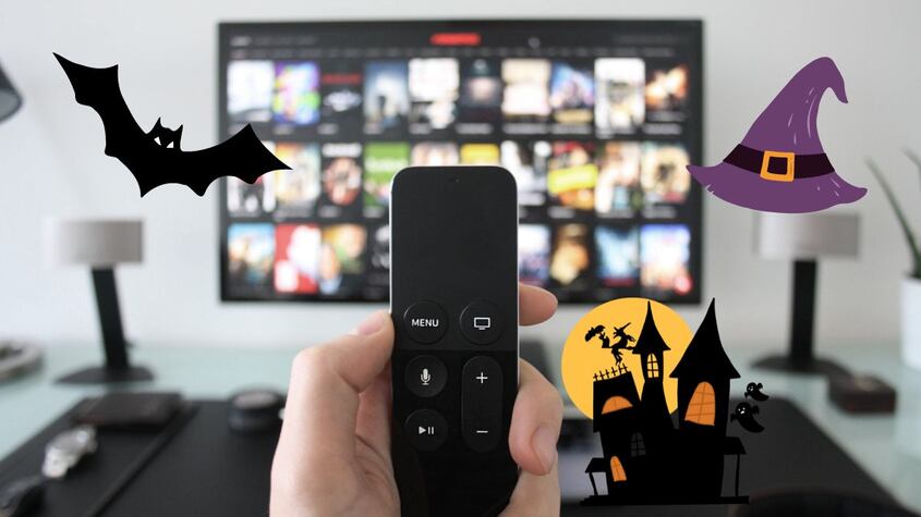 control de televisión con tv prendida